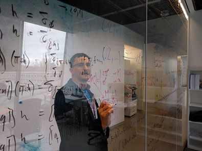 EGS as Satoshi, writing backwards on glass like Leonardo da Vinci.